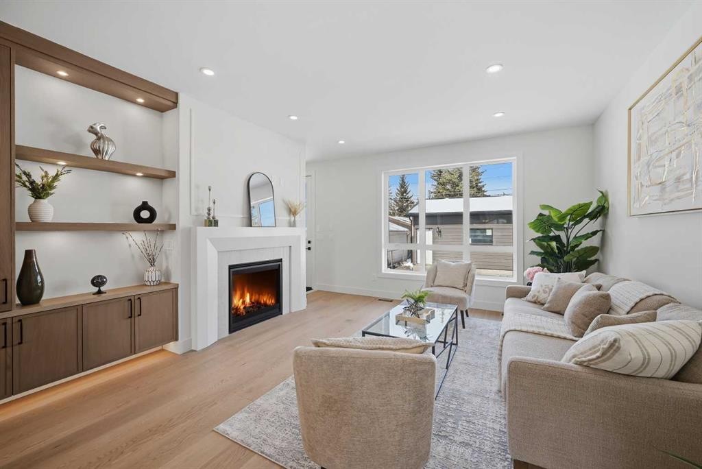 8140 47 Avenue Nw, Calgary, AB - Indoor Photo Showing Living Room With Fireplace