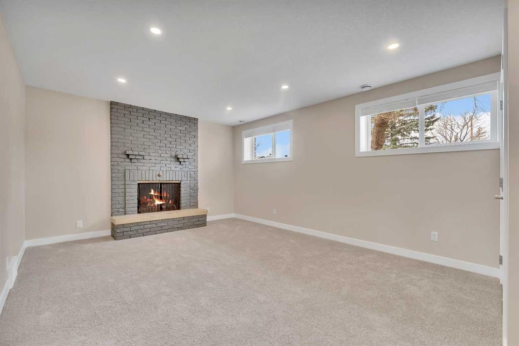 221 Madeira Crescent Ne, Calgary, AB - Indoor With Fireplace