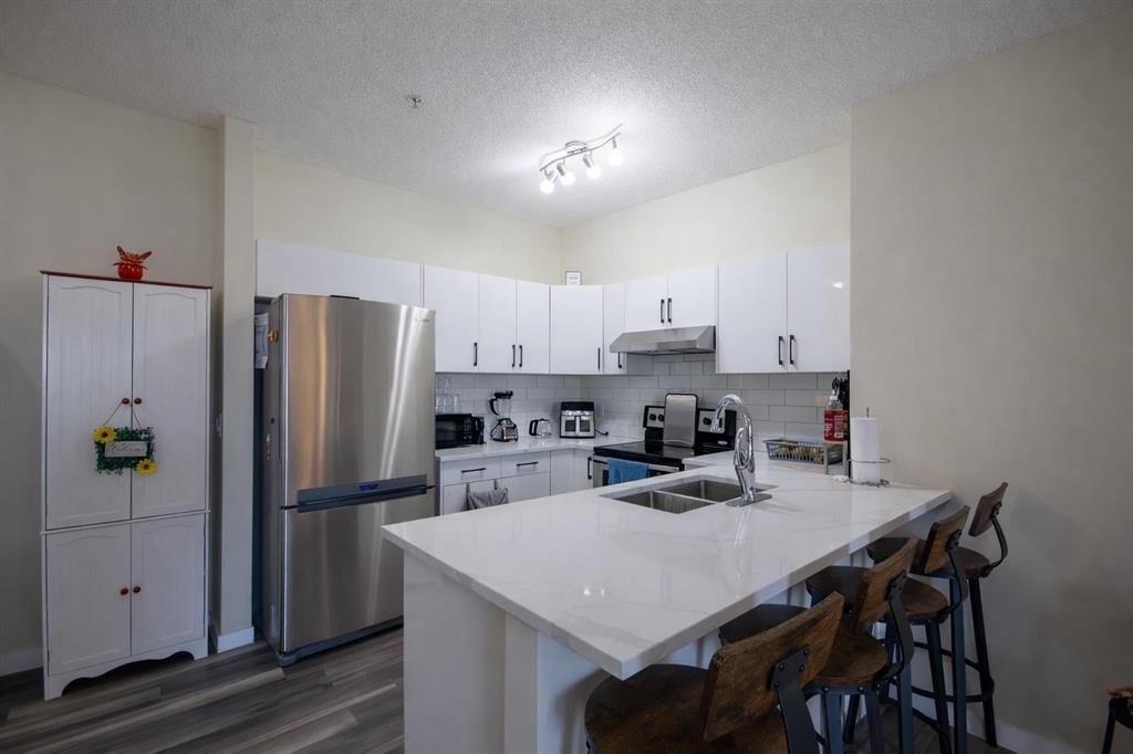 1117-1140 Taradale Drive Ne, Calgary, AB - Indoor Photo Showing Kitchen With Double Sink