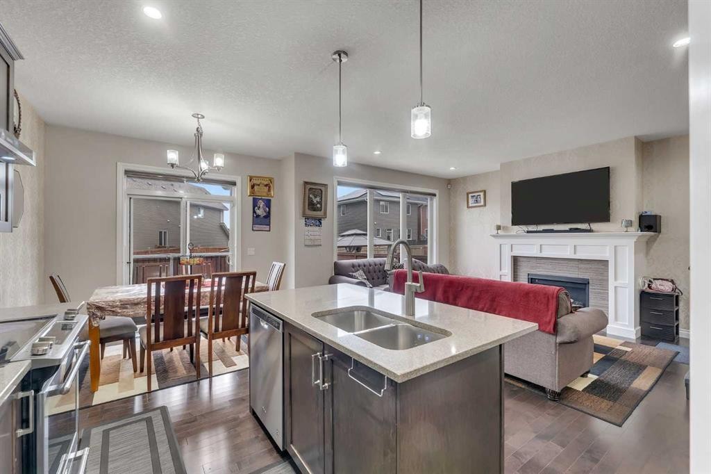 28 Saddlelake Common Ne, Calgary, AB - Indoor Photo Showing Other Room With Fireplace