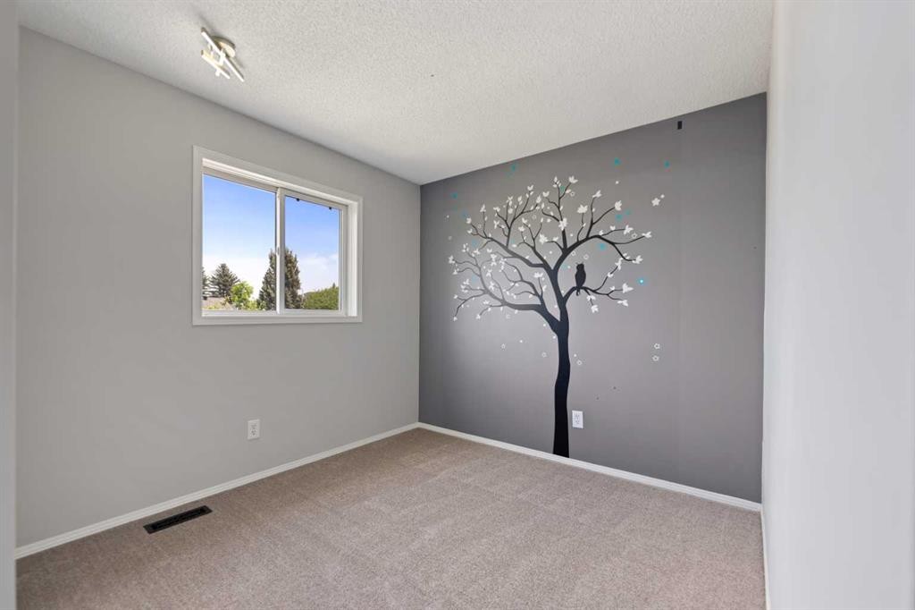 42 River Rock Road Se, Calgary, AB - Indoor Photo Showing Other Room