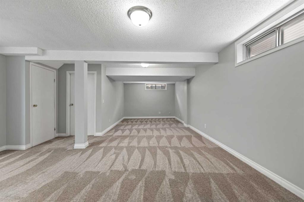 42 River Rock Road Se, Calgary, AB - Indoor Photo Showing Other Room