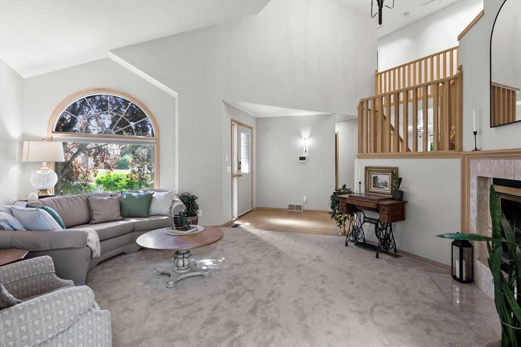 75 Hawkside Close Nw, Calgary, AB - Indoor Photo Showing Other Room With Fireplace