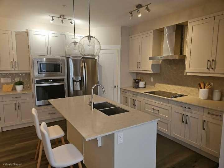 217-30 Walgrove Walk Se, Calgary, AB - Indoor Photo Showing Kitchen With Stainless Steel Kitchen With Double Sink With Upgraded Kitchen