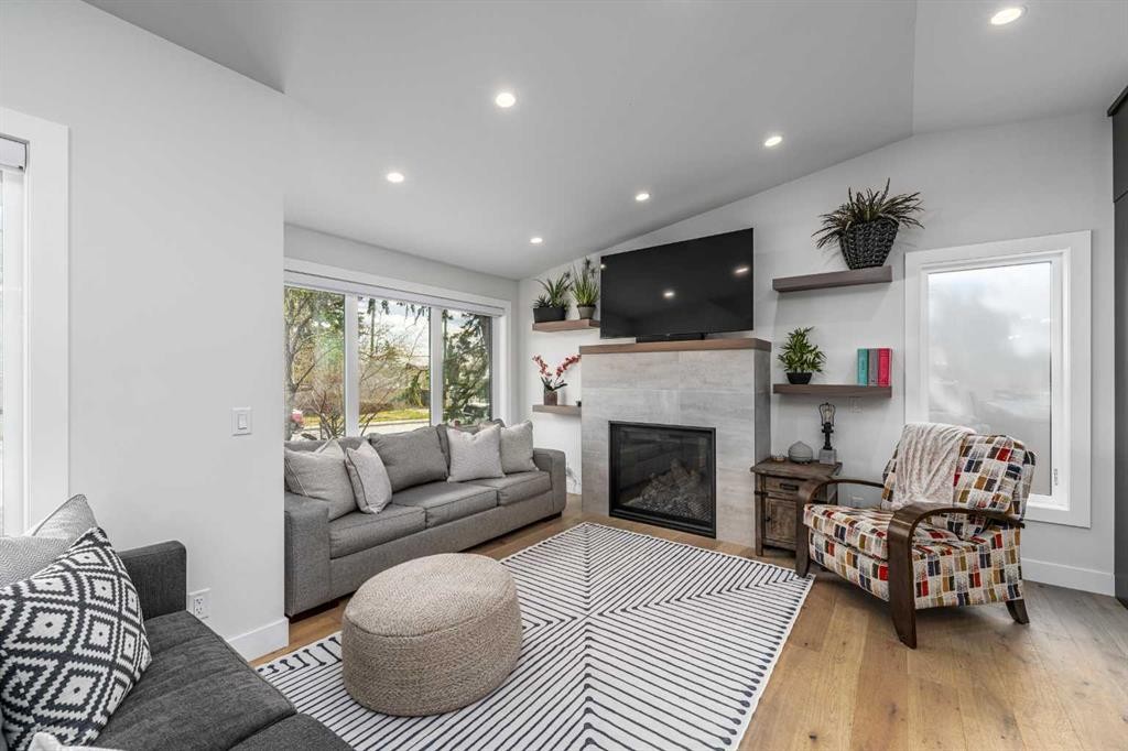 2328 58 Avenue Sw, Calgary, AB - Indoor Photo Showing Living Room With Fireplace