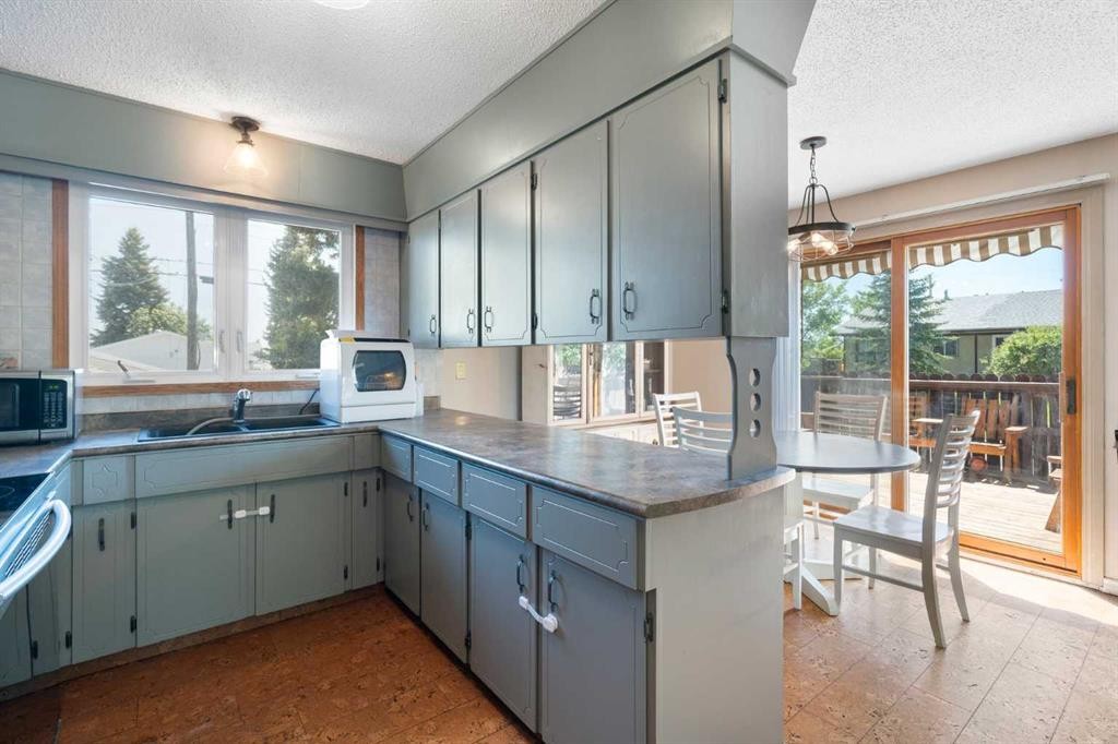 4609 Marcombe Way Ne, Calgary, AB - Indoor Photo Showing Kitchen With Double Sink