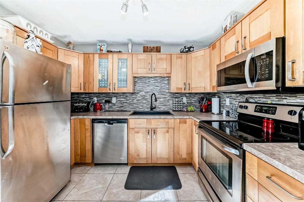 13-1845 Lysander Crescent Se, Calgary, AB - Indoor Photo Showing Kitchen With Stainless Steel Kitchen