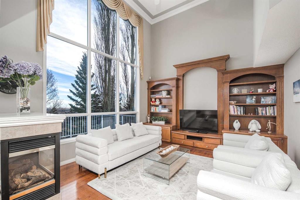 143 Hamptons Terrace Nw, Calgary, AB - Indoor Photo Showing Living Room With Fireplace