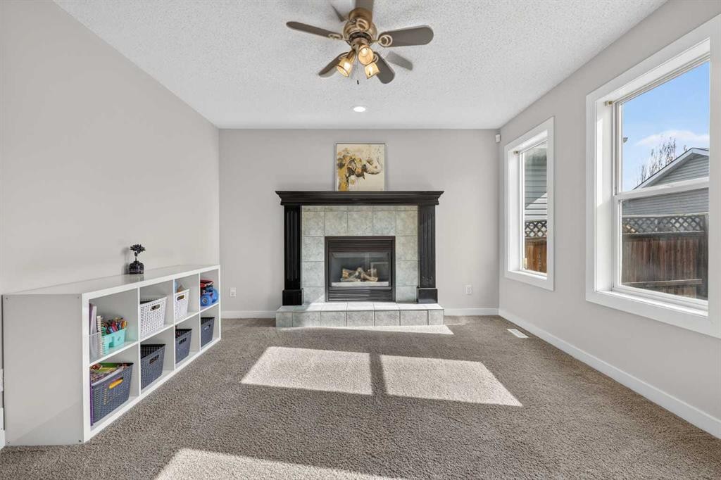 988 Prestwick Circle Se, Calgary, AB - Indoor Photo Showing Living Room With Fireplace