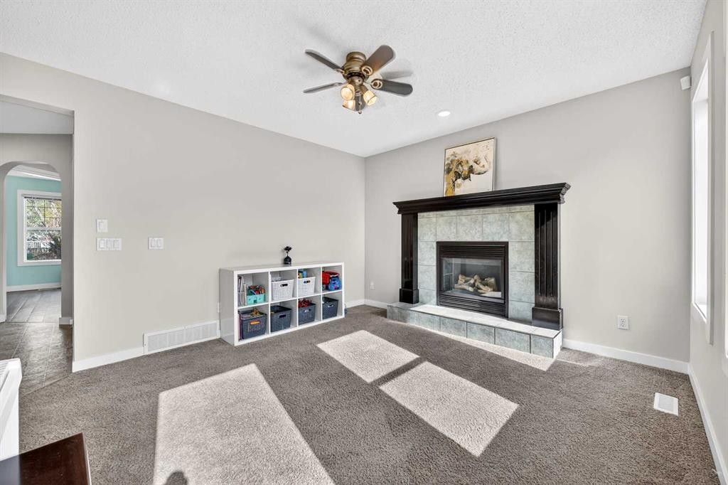 988 Prestwick Circle Se, Calgary, AB - Indoor Photo Showing Living Room With Fireplace