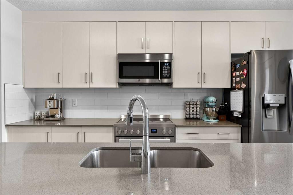 340 Cranbrook Square Se, Calgary, AB - Indoor Photo Showing Kitchen With Double Sink With Upgraded Kitchen