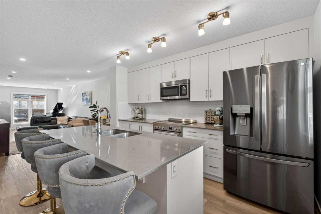 340 Cranbrook Square Se, Calgary, AB - Indoor Photo Showing Kitchen With Stainless Steel Kitchen With Double Sink With Upgraded Kitchen