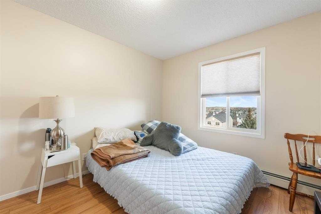 1406-12 Cimarron Common, Okotoks, AB - Indoor Photo Showing Bedroom