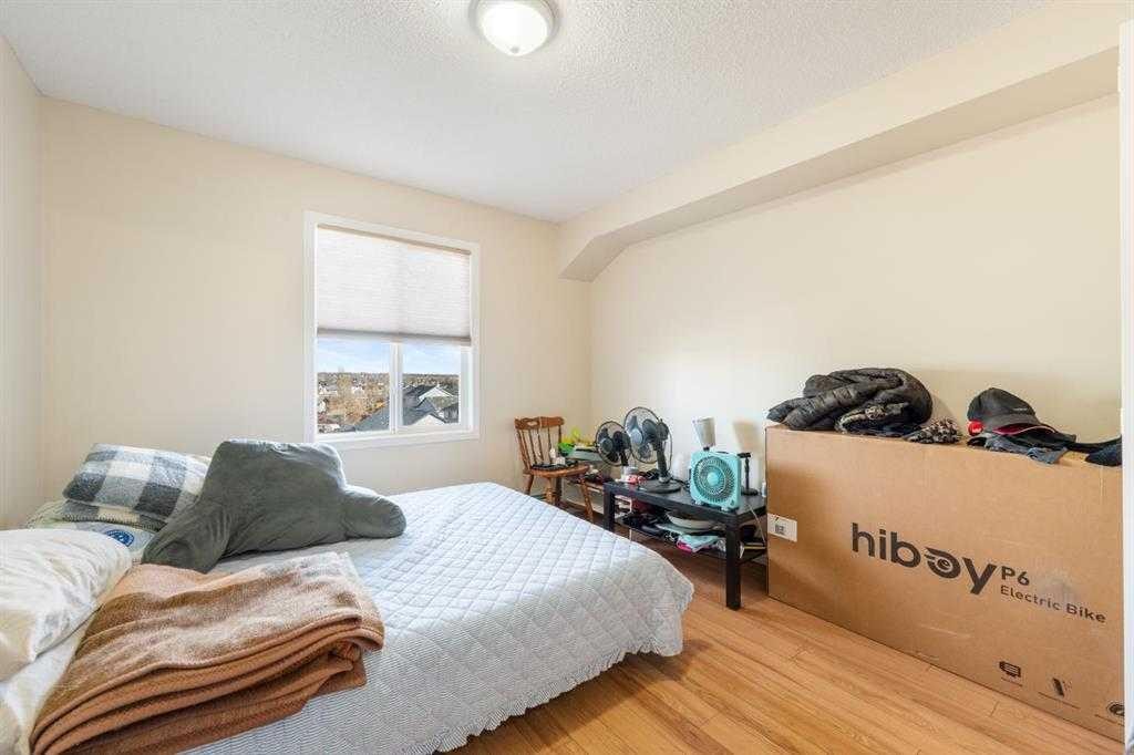 1406-12 Cimarron Common, Okotoks, AB - Indoor Photo Showing Bedroom