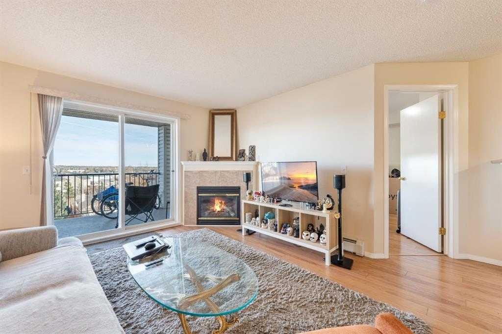 1406-12 Cimarron Common, Okotoks, AB - Indoor Photo Showing Living Room With Fireplace