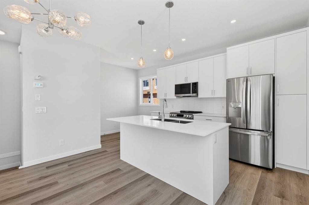 838-132 Red Embers Link Ne, Calgary, AB - Indoor Photo Showing Kitchen With Stainless Steel Kitchen With Double Sink With Upgraded Kitchen