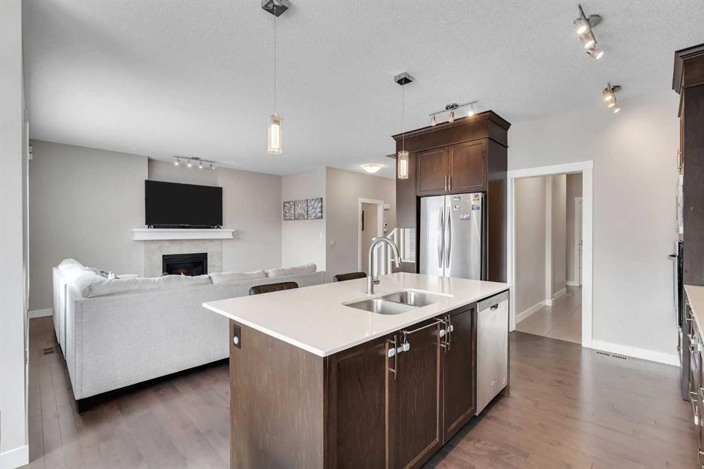 188 Cornerstone Circle Ne, Calgary, AB - Indoor Photo Showing Kitchen With Fireplace With Double Sink