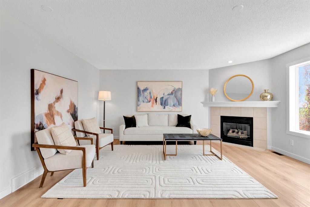 214 Royal Birch View Nw, Calgary, AB - Indoor Photo Showing Living Room With Fireplace