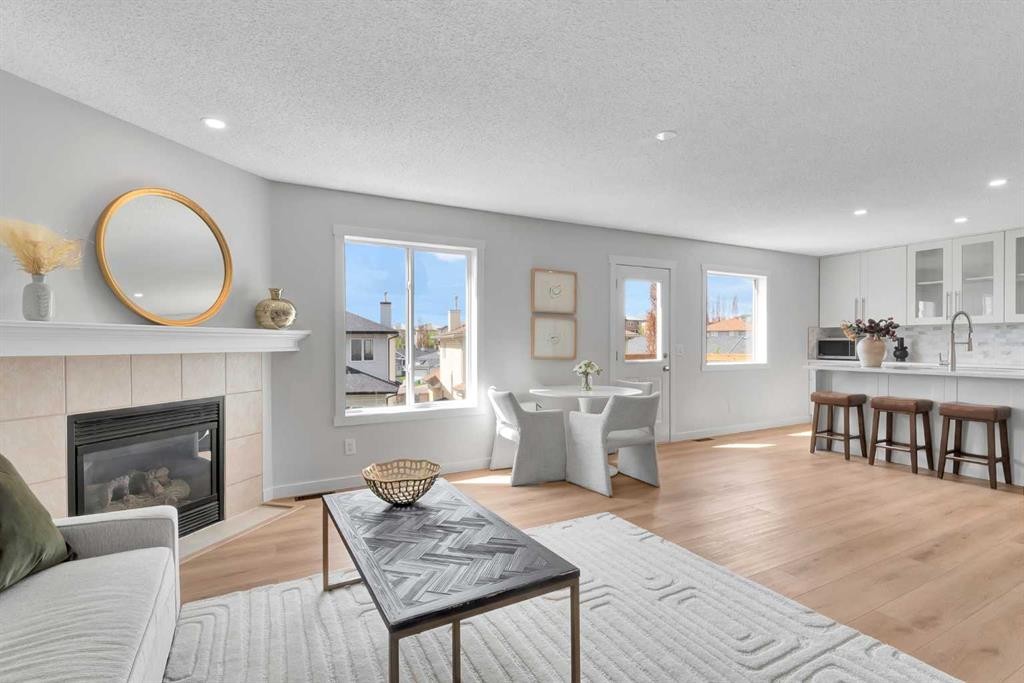 214 Royal Birch View Nw, Calgary, AB - Indoor Photo Showing Living Room With Fireplace