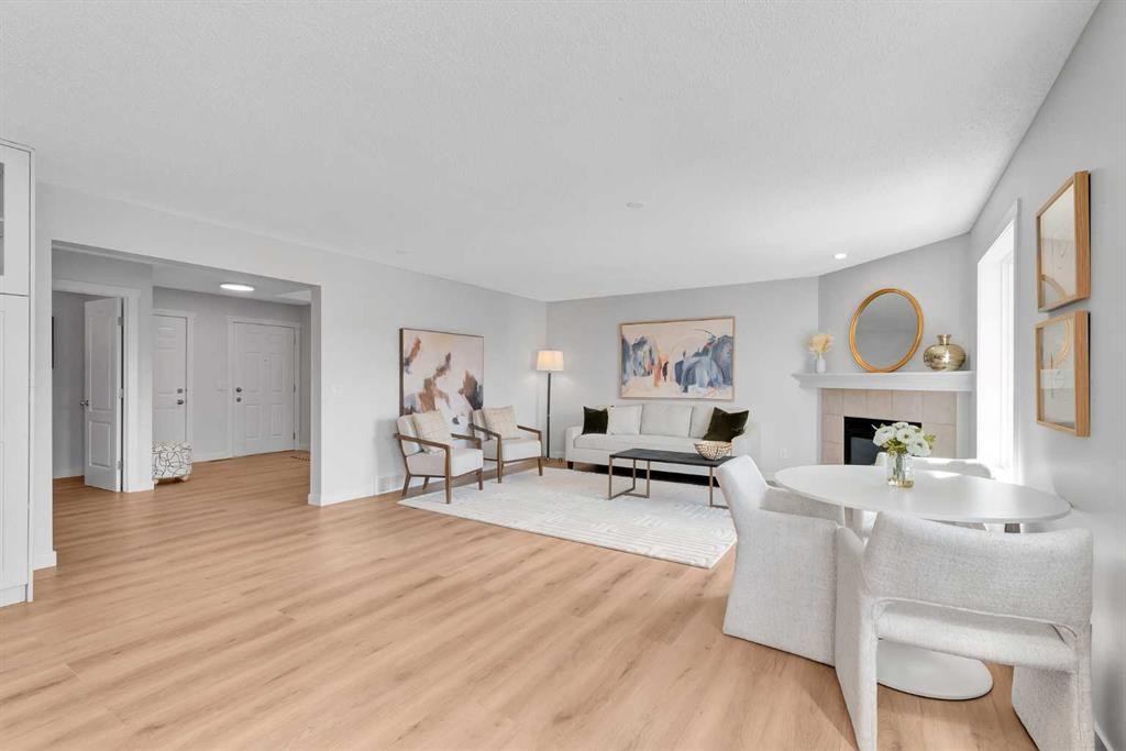 214 Royal Birch View Nw, Calgary, AB - Indoor Photo Showing Living Room With Fireplace