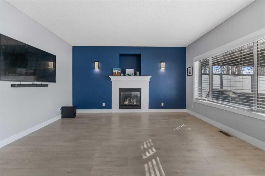 328 Rainbow Falls Way, Chestermere, AB - Indoor Photo Showing Living Room With Fireplace
