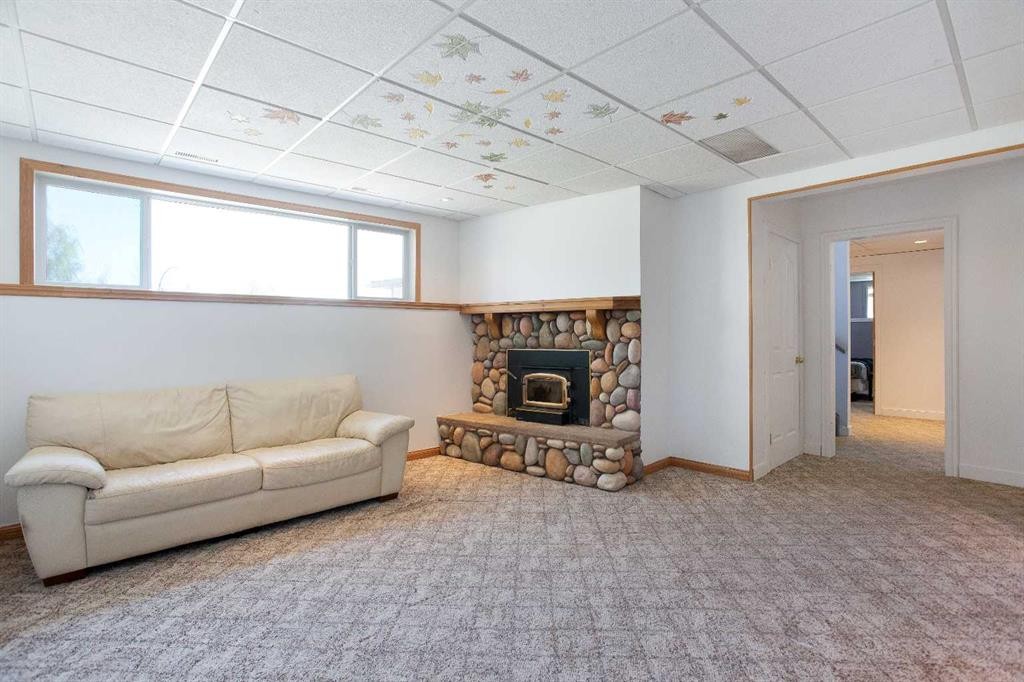 227 Cantrell Place Sw, Calgary, AB - Indoor With Fireplace