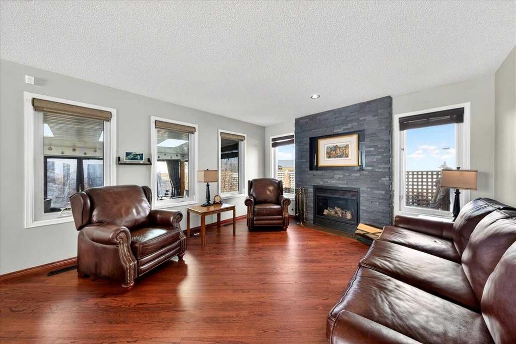 18 Inverness Rise Se, Calgary, AB - Indoor Photo Showing Living Room With Fireplace