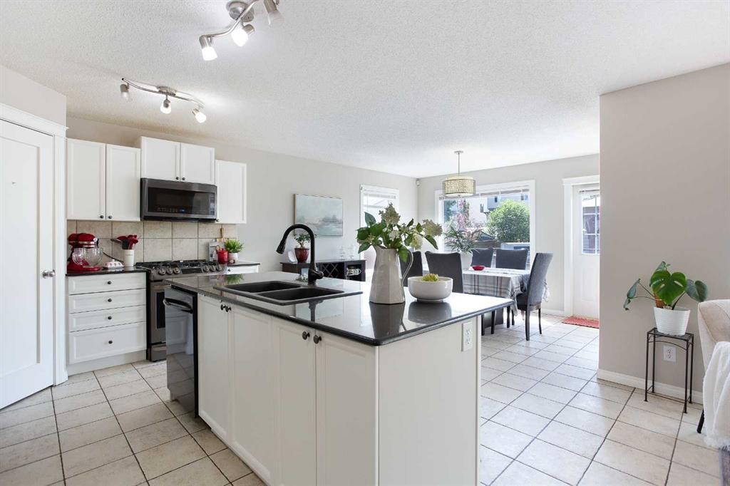 403 Morningside Way Sw, Airdrie, AB - Indoor Photo Showing Kitchen With Double Sink