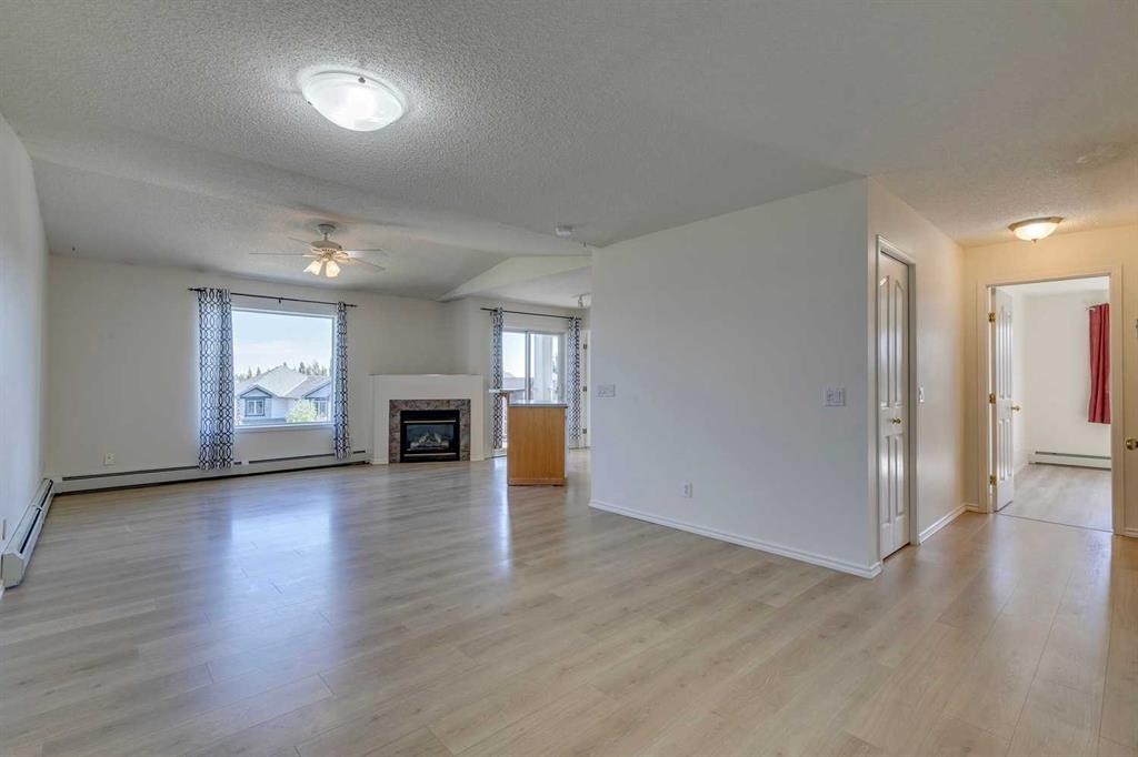 301-7301 Valleyview Park Se, Calgary, AB - Indoor Photo Showing Living Room With Fireplace