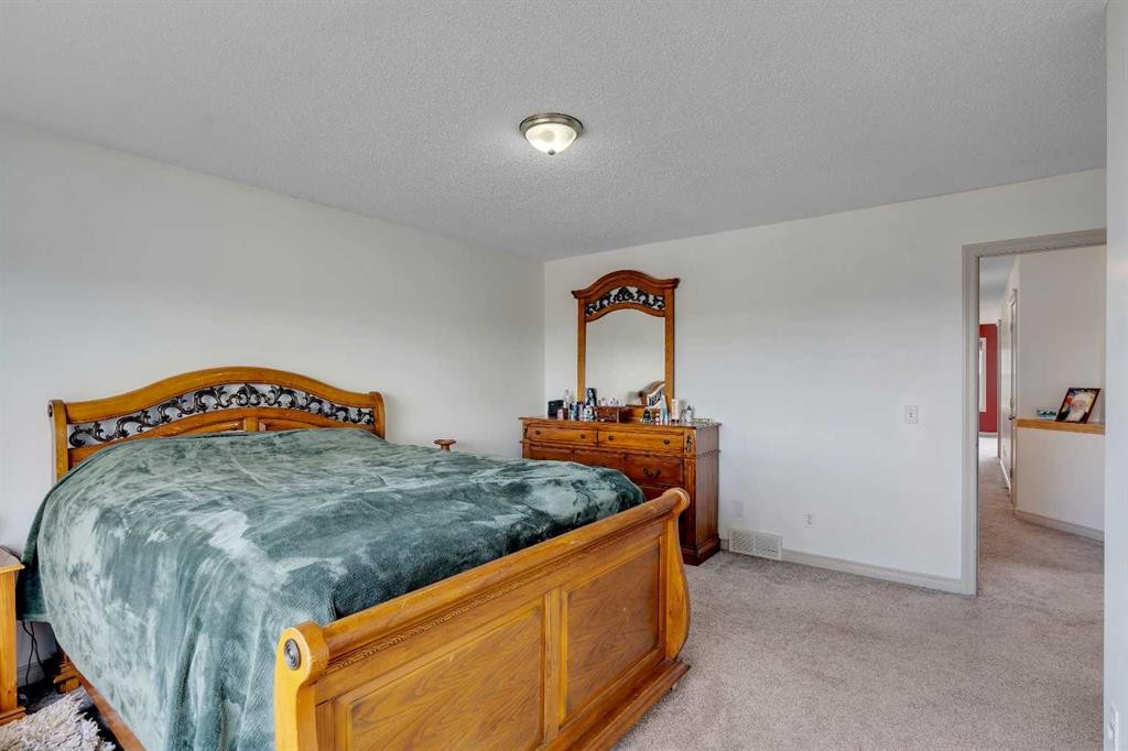 133 Everwoods Close Sw, Calgary, AB - Indoor Photo Showing Bedroom