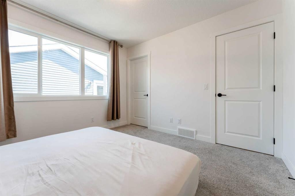 76 Lucas Boulevard Nw, Calgary, AB - Indoor Photo Showing Bedroom