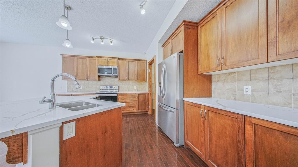 393 Windermere Drive, Chestermere, AB - Indoor Photo Showing Kitchen With Double Sink