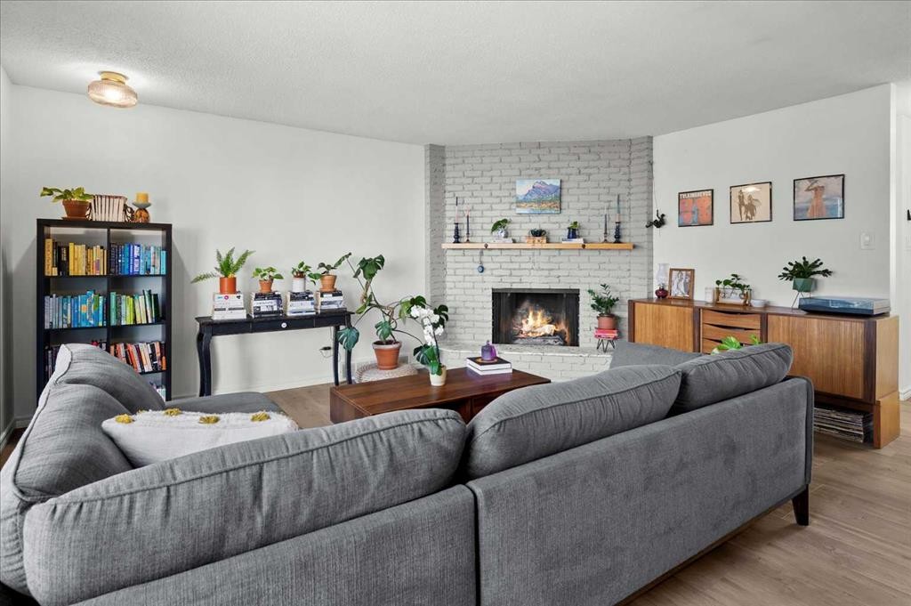 20 Brampton Crescent Sw, Calgary, AB - Indoor Photo Showing Living Room With Fireplace