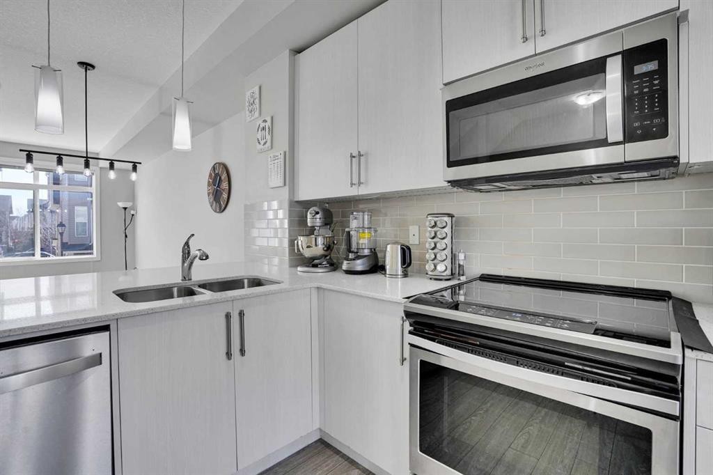 104 Legacy Path Se, Calgary, AB - Indoor Photo Showing Kitchen With Double Sink