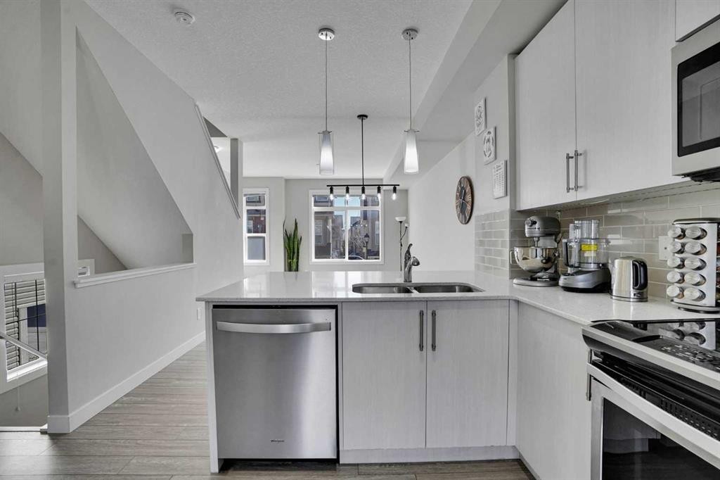 104 Legacy Path Se, Calgary, AB - Indoor Photo Showing Kitchen With Double Sink
