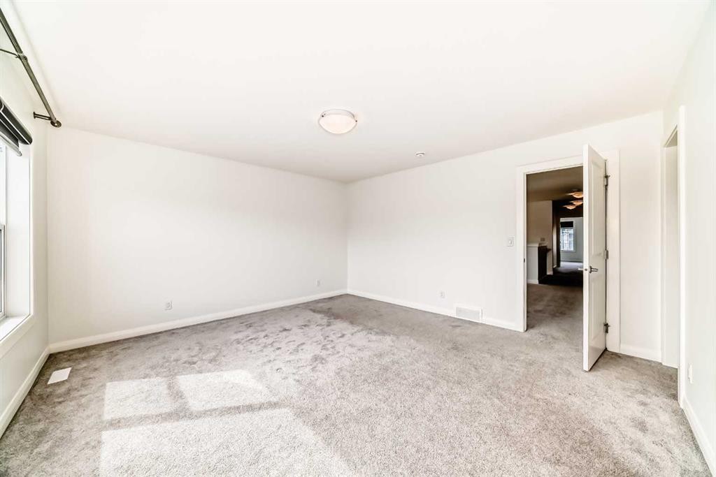84 Evansfield Close Nw, Calgary, AB - Indoor Photo Showing Other Room