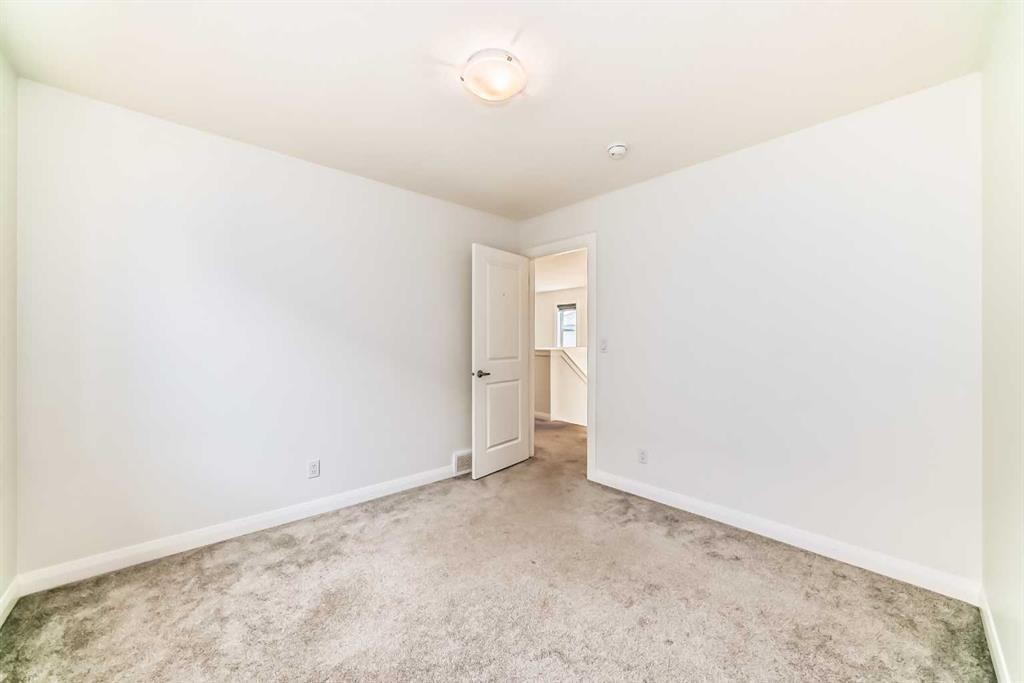 84 Evansfield Close Nw, Calgary, AB - Indoor Photo Showing Other Room