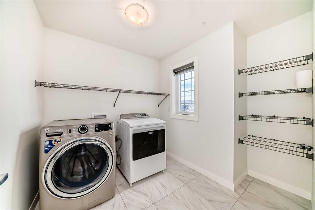 84 Evansfield Close Nw, Calgary, AB - Indoor Photo Showing Laundry Room