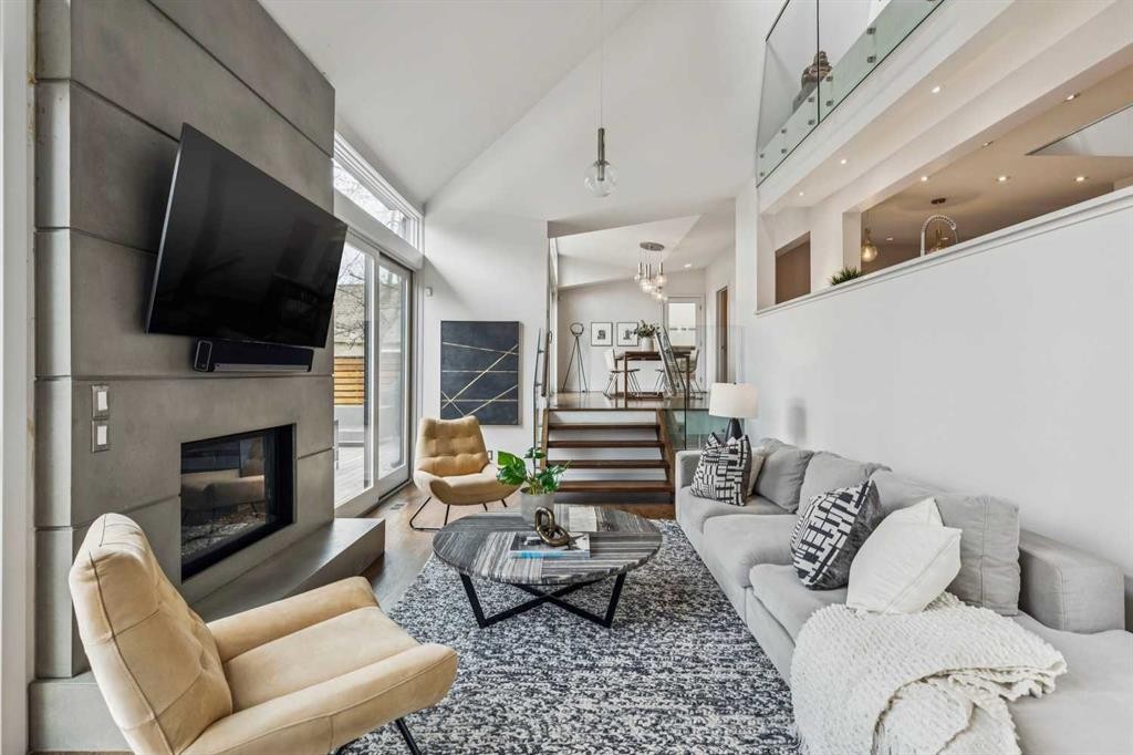 3905 Edison Crescent Sw, Calgary, AB - Indoor Photo Showing Living Room With Fireplace