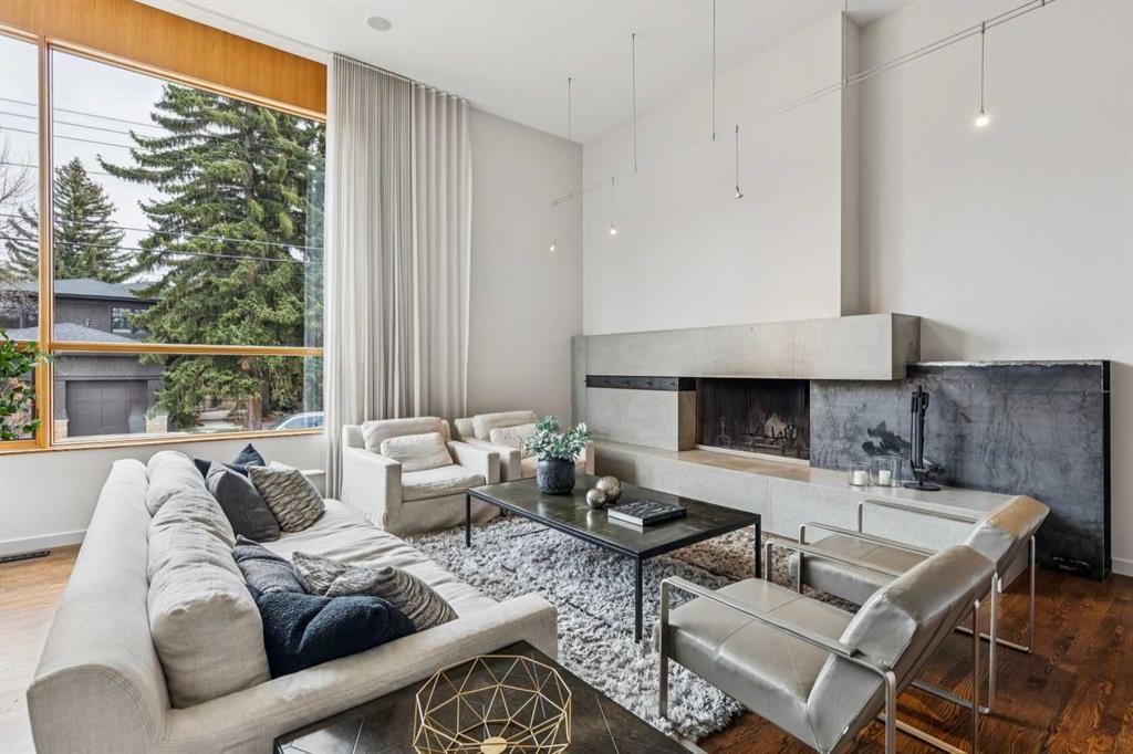 3905 Edison Crescent Sw, Calgary, AB - Indoor Photo Showing Living Room With Fireplace