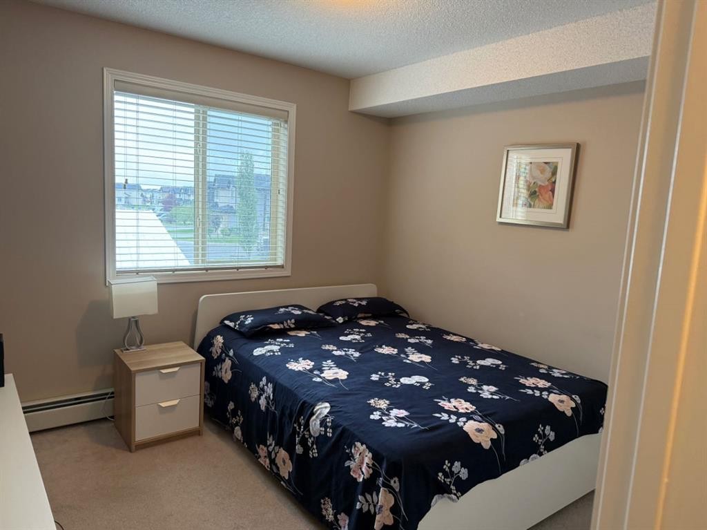 202-7210 80 Avenue Ne, Calgary, AB - Indoor Photo Showing Bedroom