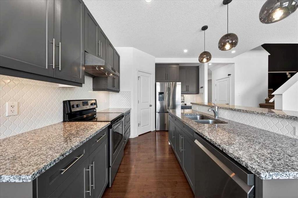 20 Nolancrest Green Nw, Calgary, AB - Indoor Photo Showing Kitchen With Double Sink With Upgraded Kitchen