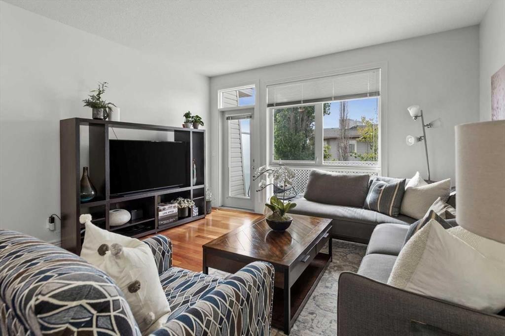 1-164 Rockyledge View Nw, Calgary, AB - Indoor Photo Showing Living Room