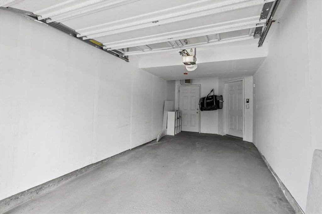 1-164 Rockyledge View Nw, Calgary, AB - Indoor Photo Showing Garage