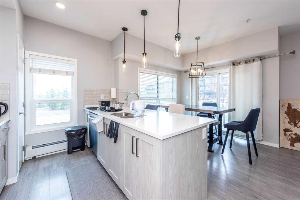 116-4350 Seton Drive Se, Calgary, AB - Indoor Photo Showing Kitchen With Double Sink With Upgraded Kitchen