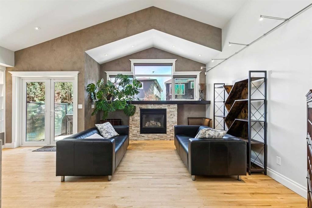 367 Discovery Place Sw, Calgary, AB - Indoor Photo Showing Living Room With Fireplace