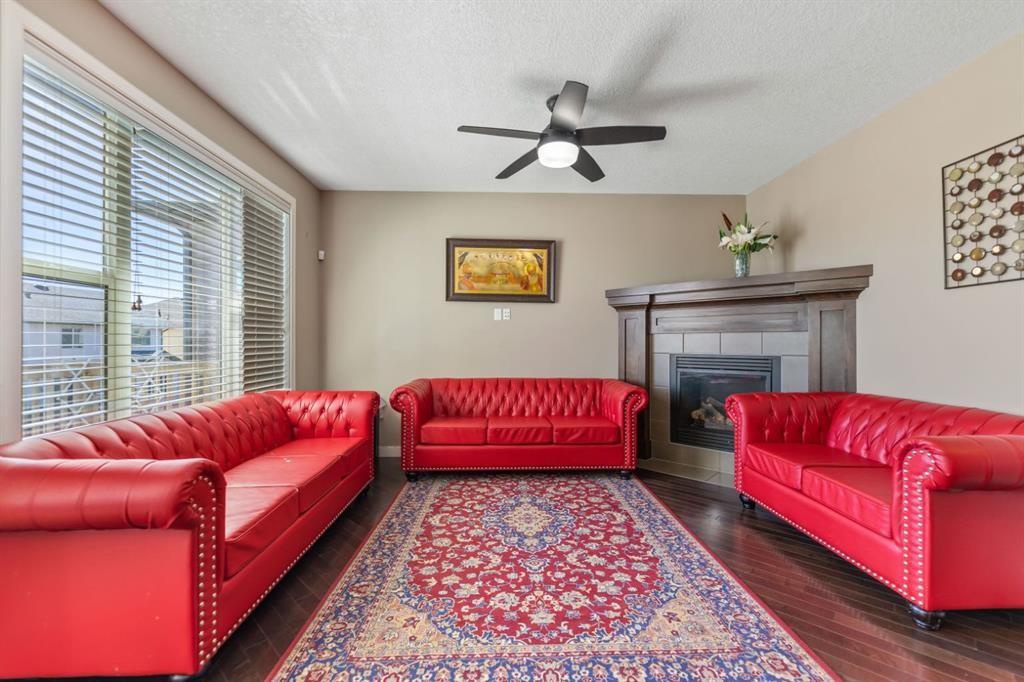130 Brightonwoods Grove Se, Calgary, AB - Indoor Photo Showing Living Room With Fireplace