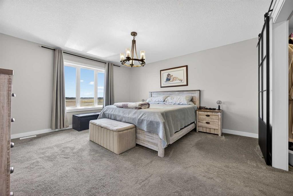 10 Bishop Circle, Carstairs, AB - Indoor Photo Showing Bedroom