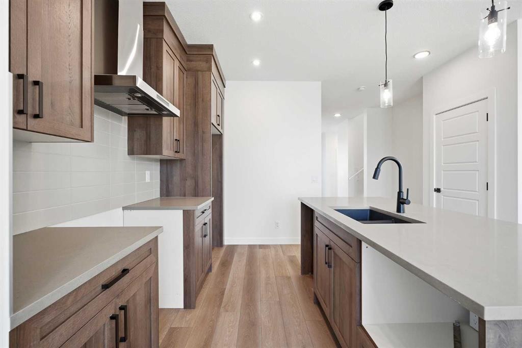 201 Bridgeport Gate, Chestermere, AB - Indoor Photo Showing Kitchen With Upgraded Kitchen