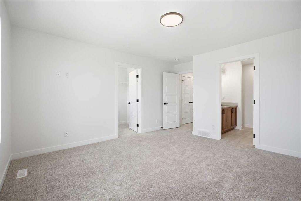 201 Bridgeport Gate, Chestermere, AB - Indoor Photo Showing Other Room
